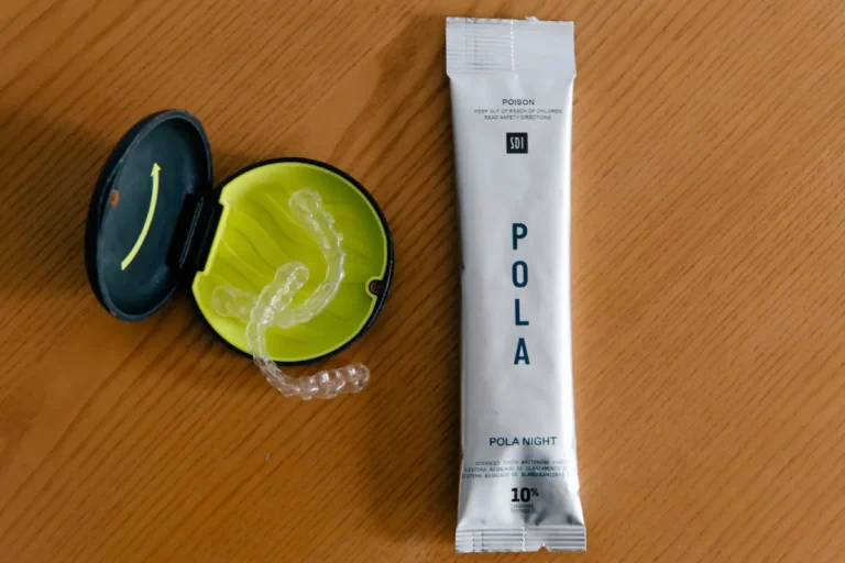 Pola Night Take-Home Teeth Whitening packet next to an Urban Smile custom whitening tray case