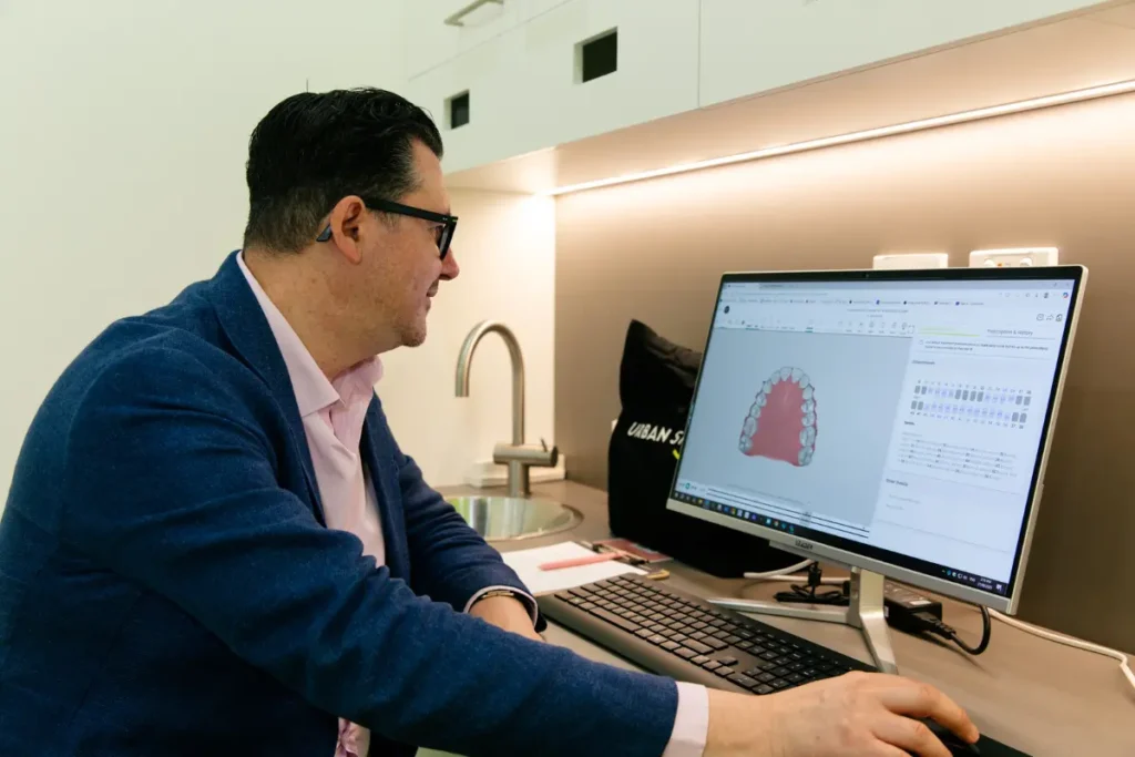 Specialist Orthodontist Dr Igor Lavrin designing a patient's clear aligner treatment plan at Urban Smile