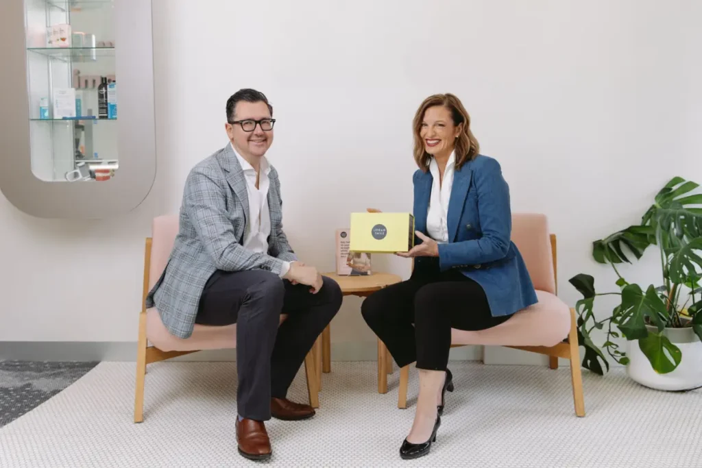 Orthodontists Dr Igor Lavrin and Dr Sarah Lawrence sitting in reception at Urban Smile Hawthorn