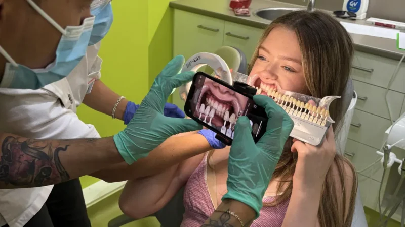 Patient getting shade matched for in-chair whitening in Urban Smile treatment room