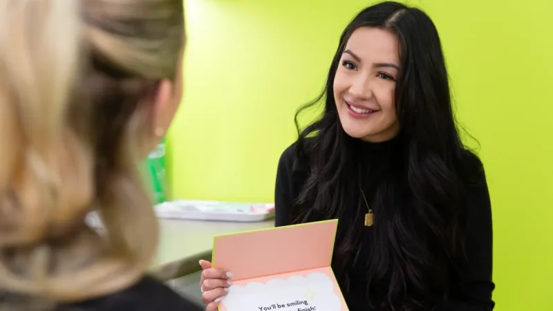 Urban Smile patient consultant explaining clear aligners in a free consultation