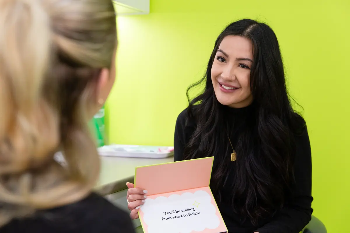 Urban Smile patient consultant explaining clear aligners in a free consultation